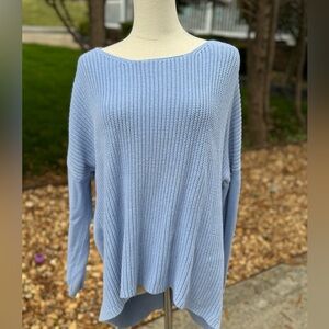 Blue sweater with a relaxed fit, a ribbed knit design and a slight cropped fit.